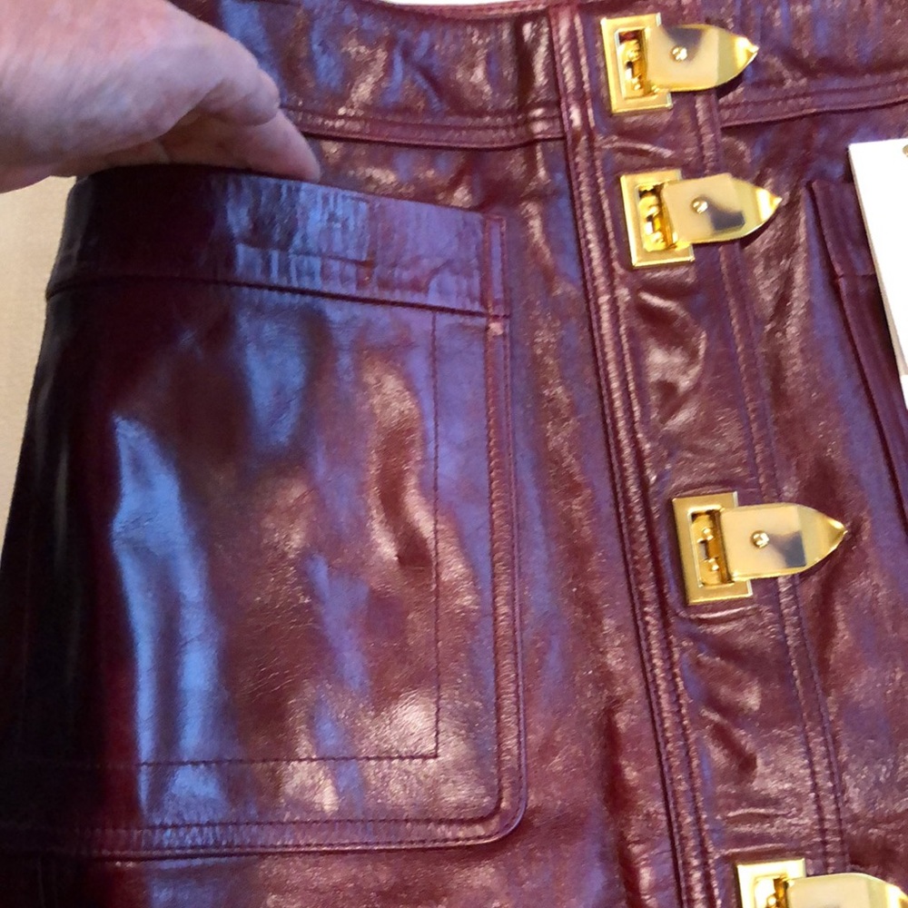 Tory Burch burgundy leather skirt with gold clasps on front - Picture 4 of 8